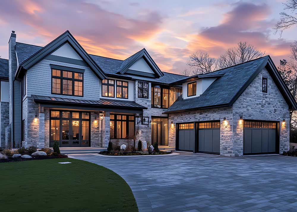 A large house with a large driveway and a large garage